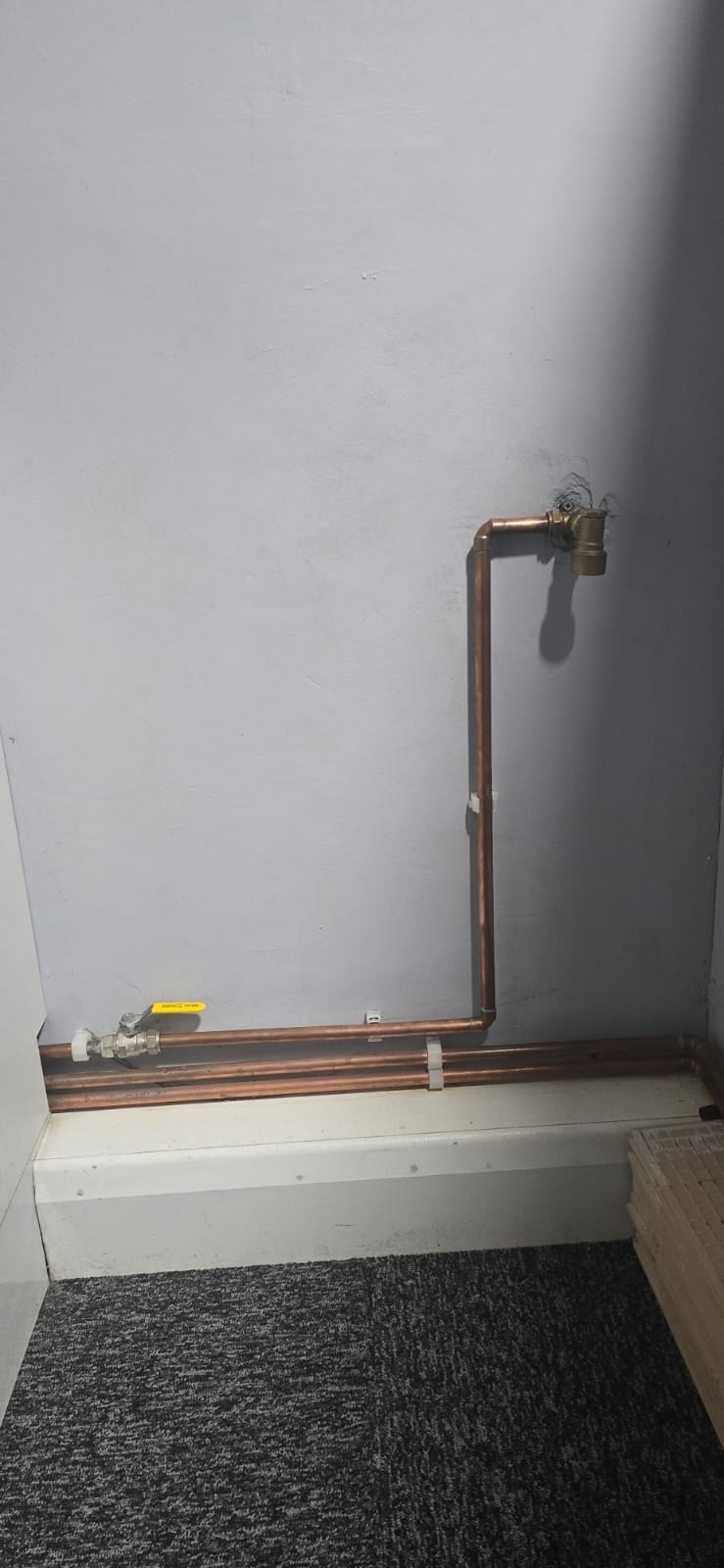 Neat copper pipework installation with isolation valve